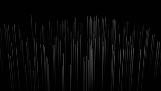 a black and white photo of lines in the dark