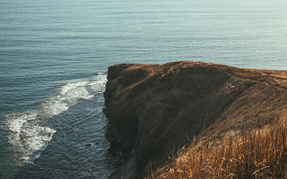 a view of the ocean from the top of a hill