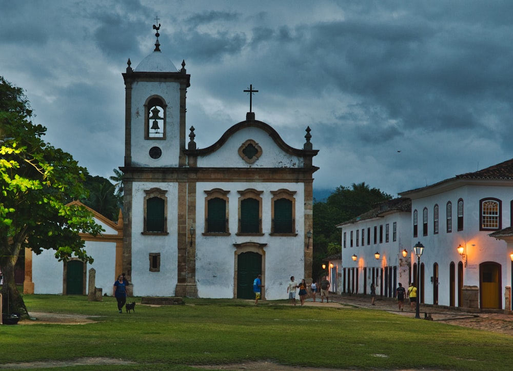 a large white church with a clock tower