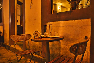 Elegant cafe corner with soft lighting and freshly brewed coffee on a wooden table.