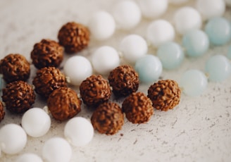 a bunch of white and brown balls on a table