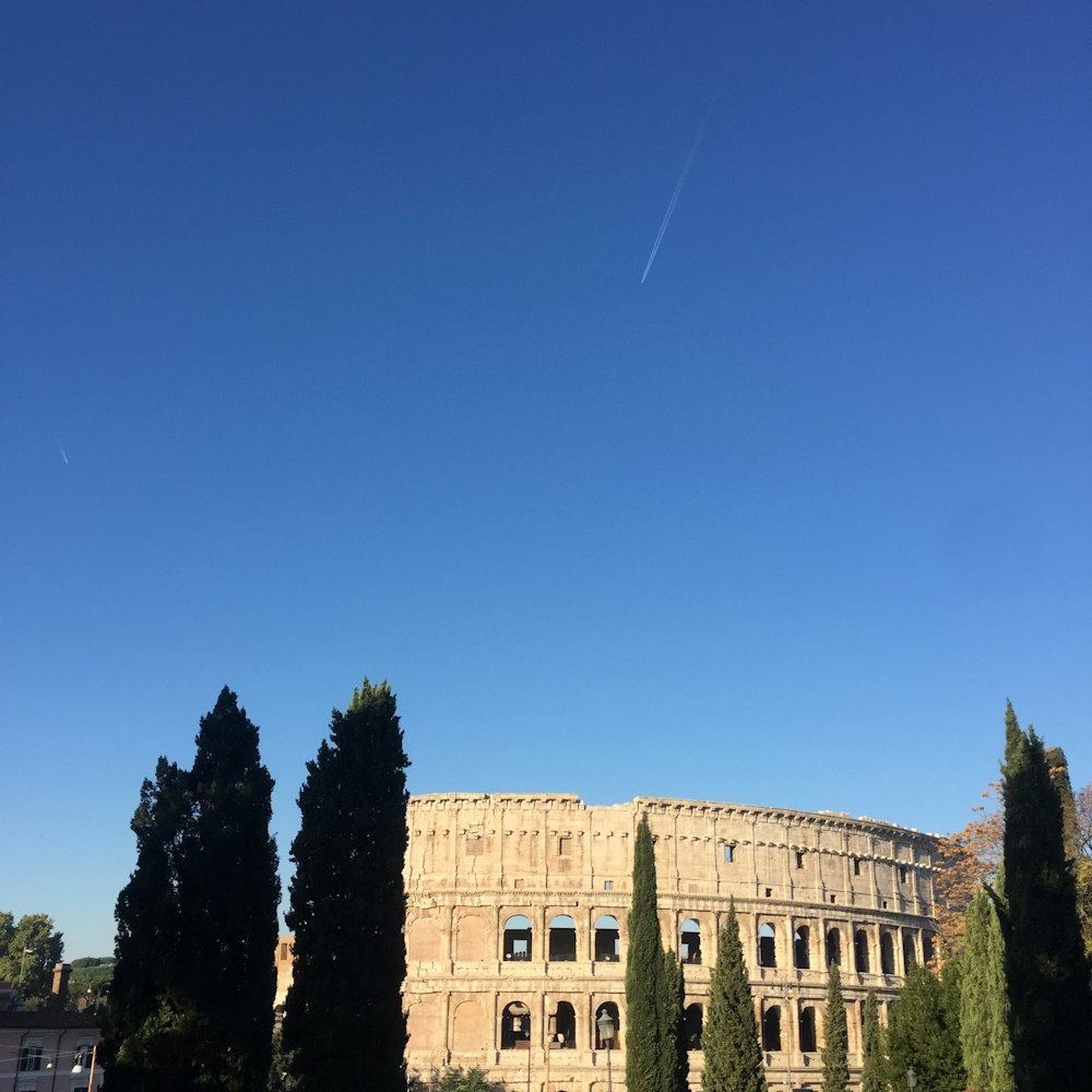 a large building with trees in front of it