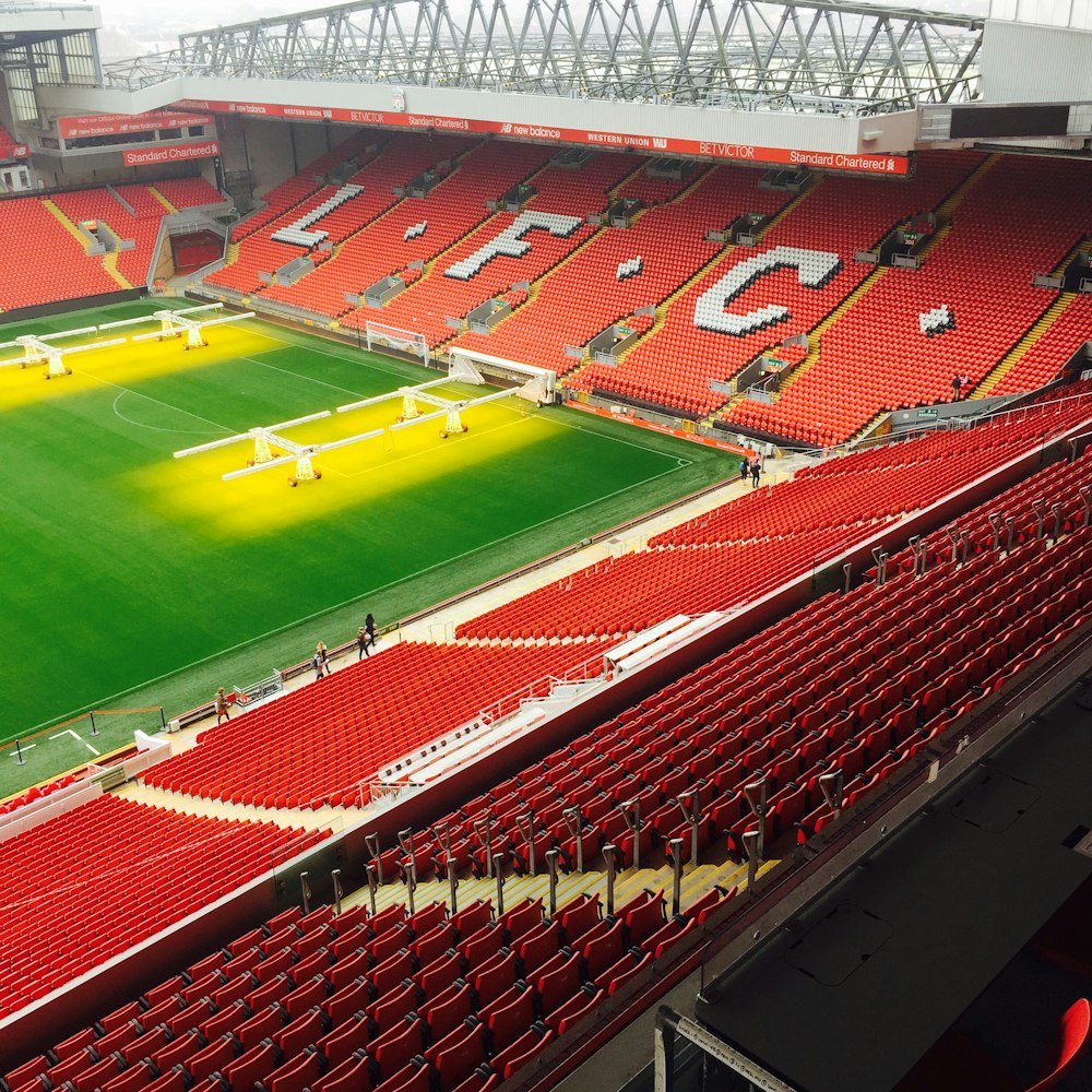 a stadium filled with lots of red seats