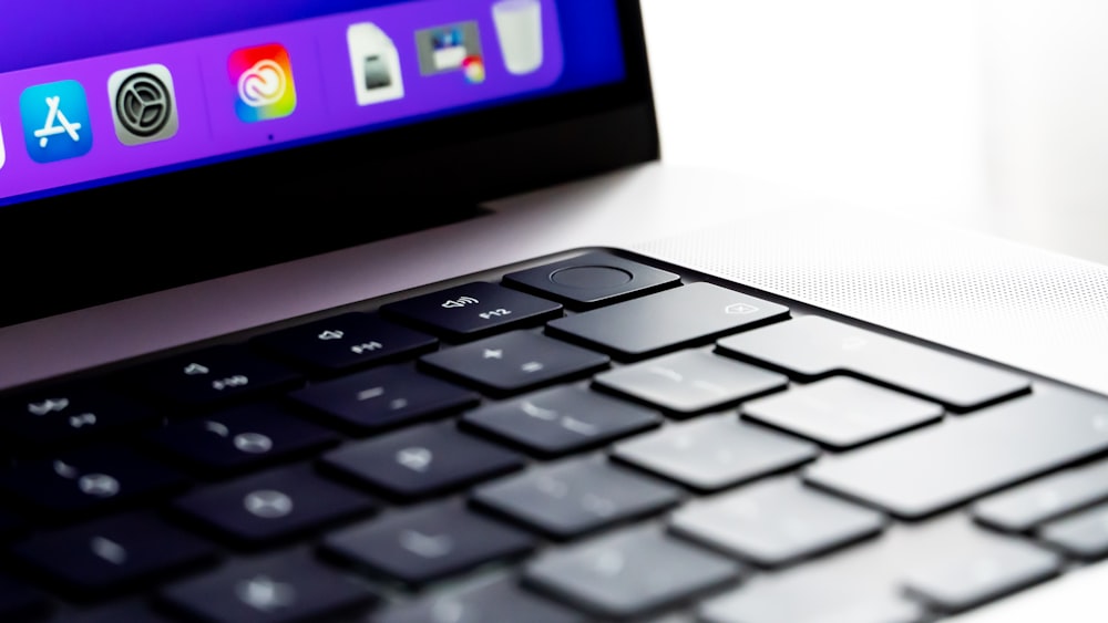 a computer keyboard sitting on top of a desk