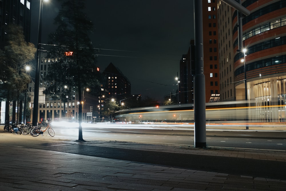 a city street at night with a long exposure