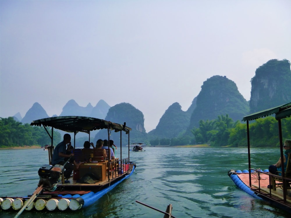 a group of people riding on top of a boat