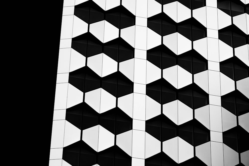 a black and white photo of a building made of cubes