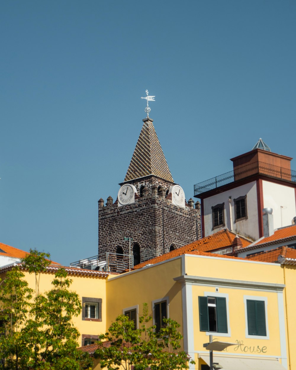 a building with a steeple and a cross on top