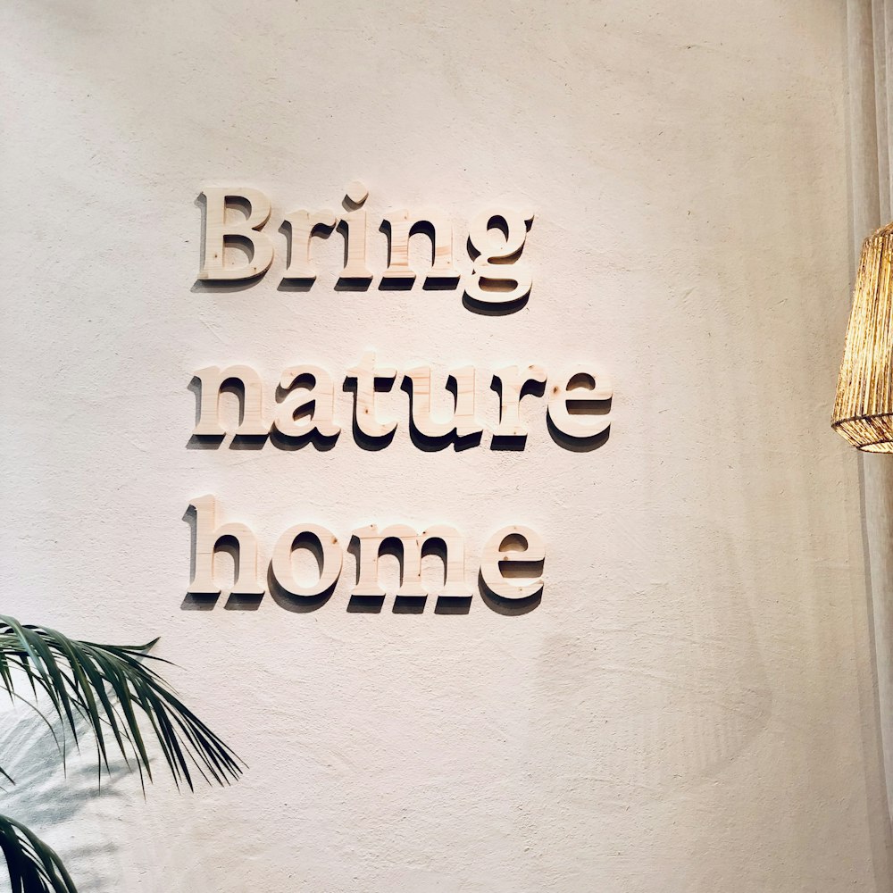a sign that says bring nature home on a wall