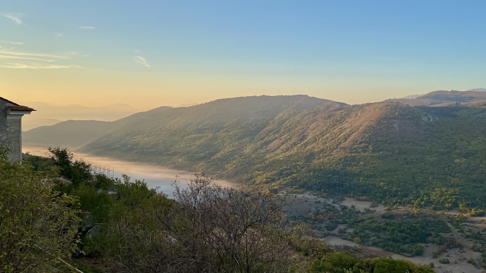 a scenic view of a valley with a river running through it