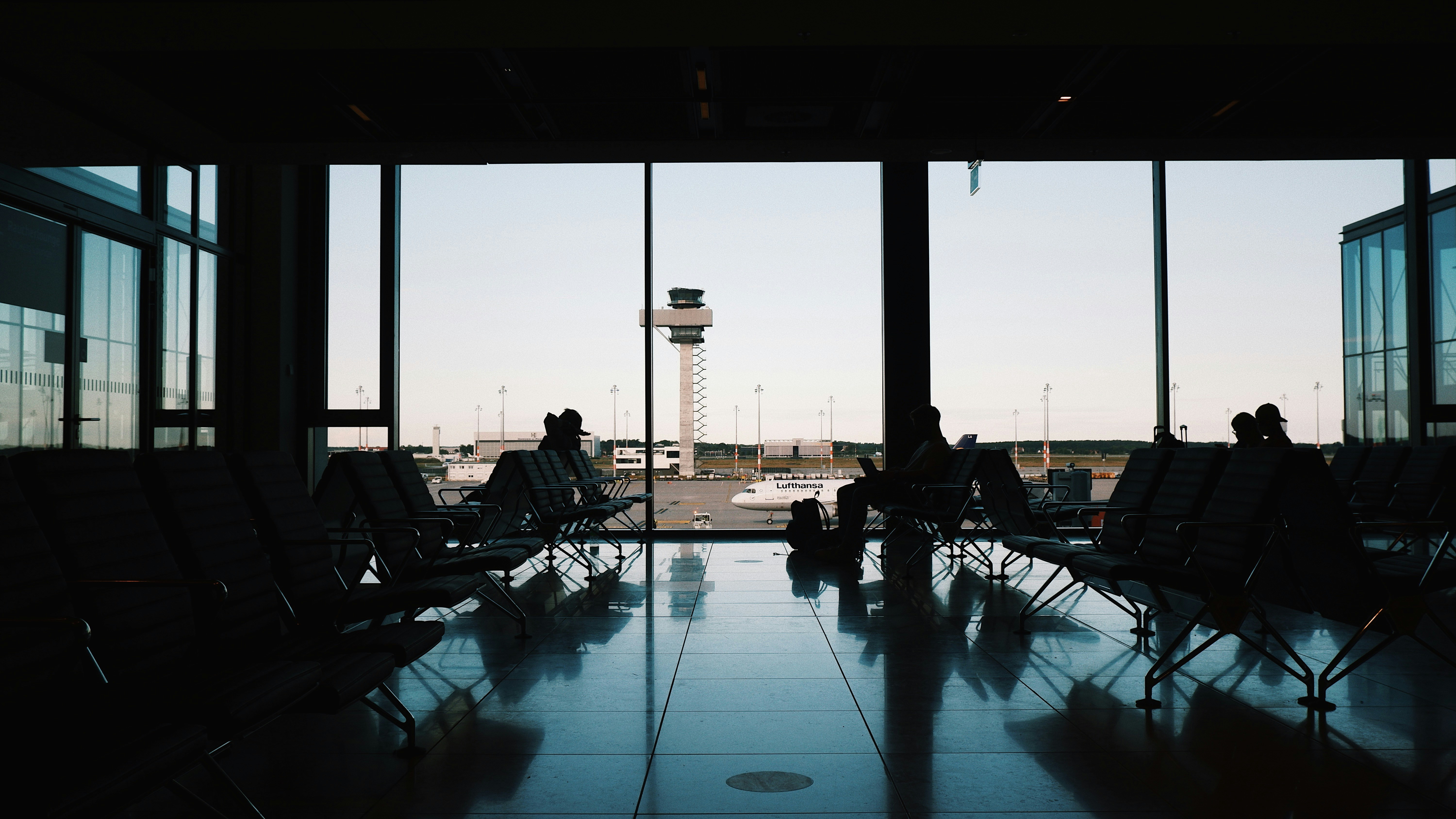 a group of people sitting in a waiting area