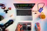 A creative workspace featuring editing screens and inspirational notes reflecting Michael's media projects