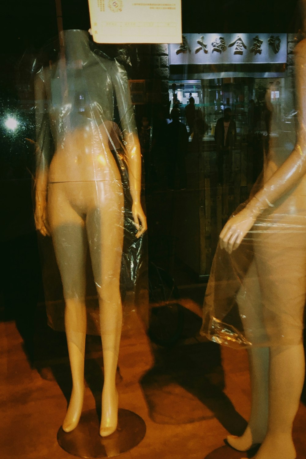 a couple of mannequins that are in a display case