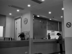 A friendly staff member assisting a client with paperwork.