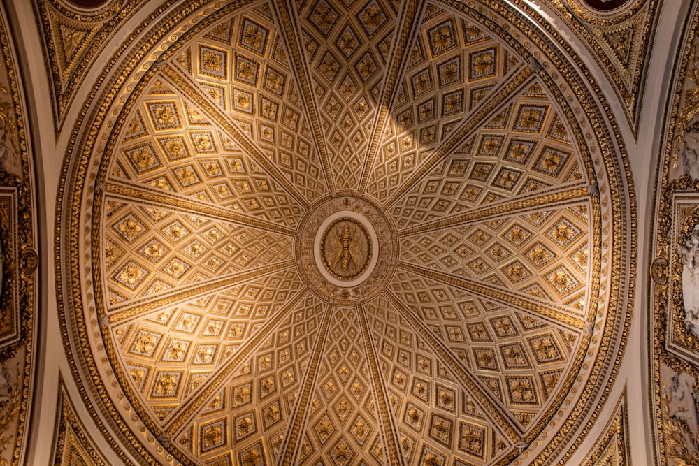 a ceiling in a building with a clock on it