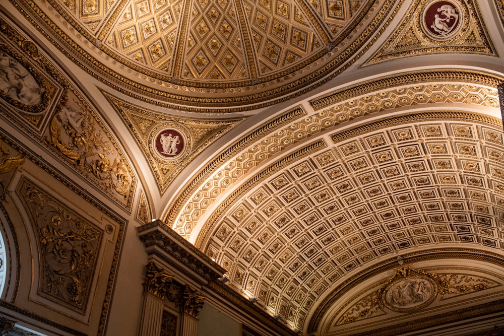 the ceiling of a building with a clock on it