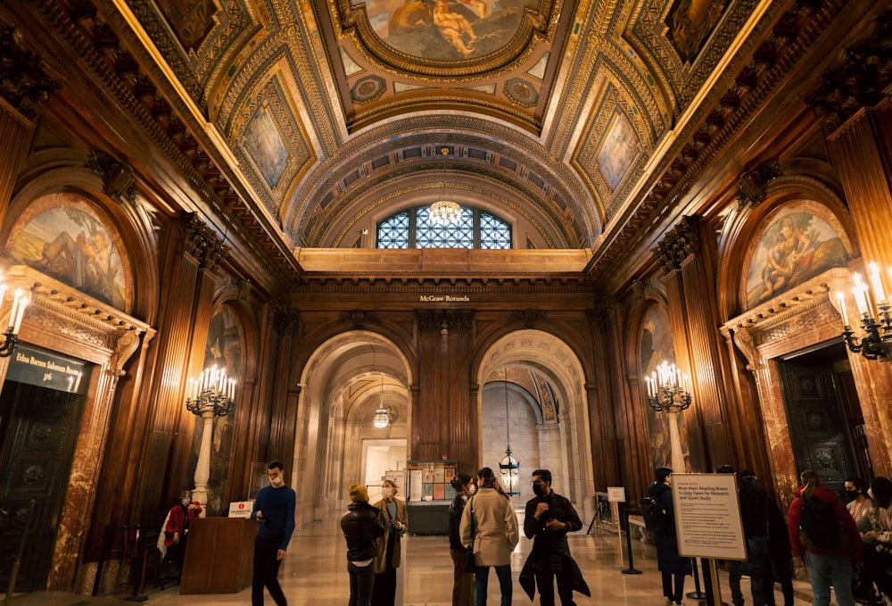 a group of people standing inside of a building