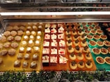 An inviting dessert display featuring various pastries and cakes.