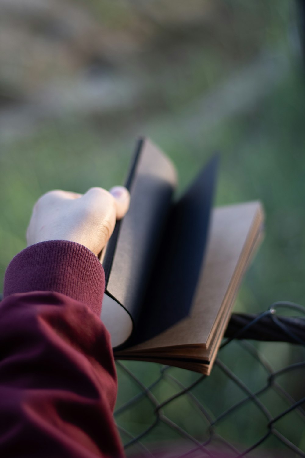 a person holding a book in their hand