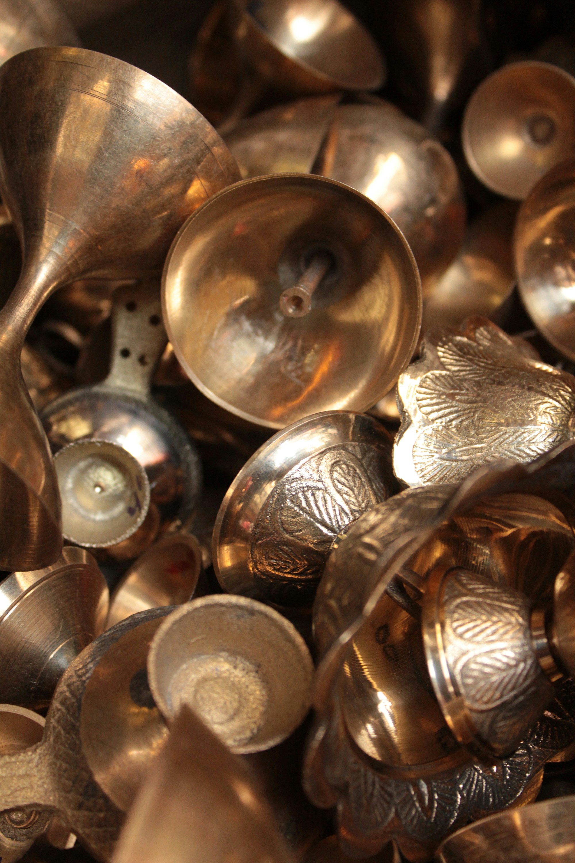 a pile of metal spoons sitting next to each other