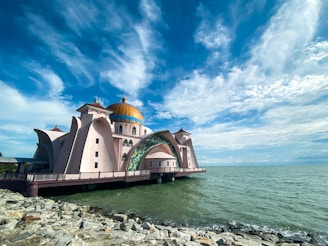 a large building sitting on top of a body of water