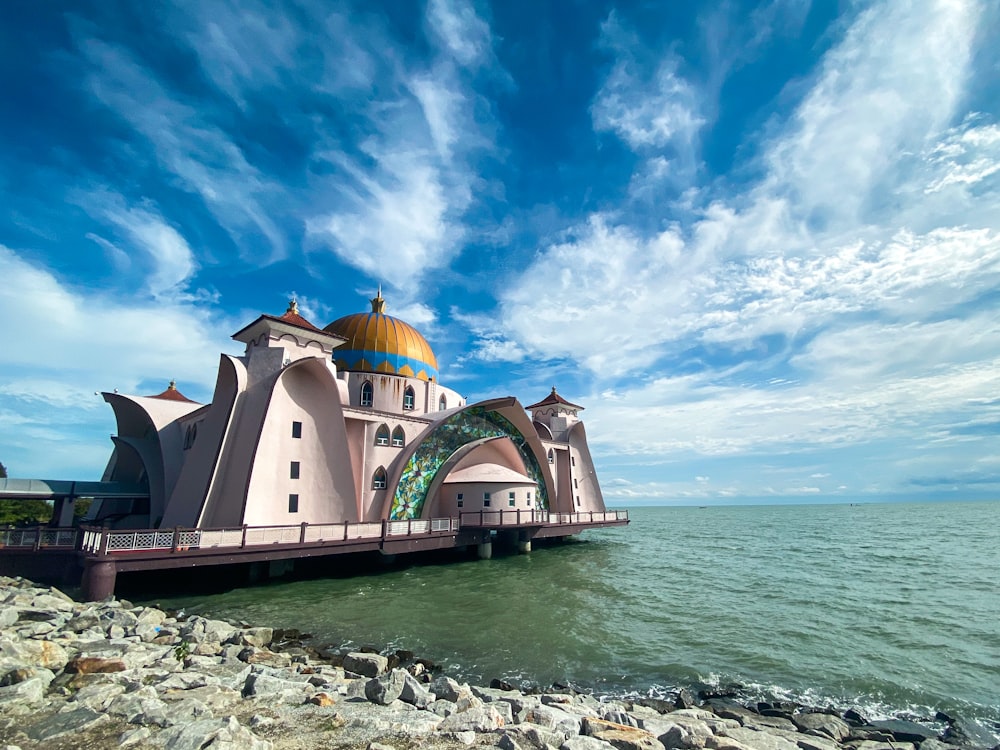 a large building sitting on top of a body of water