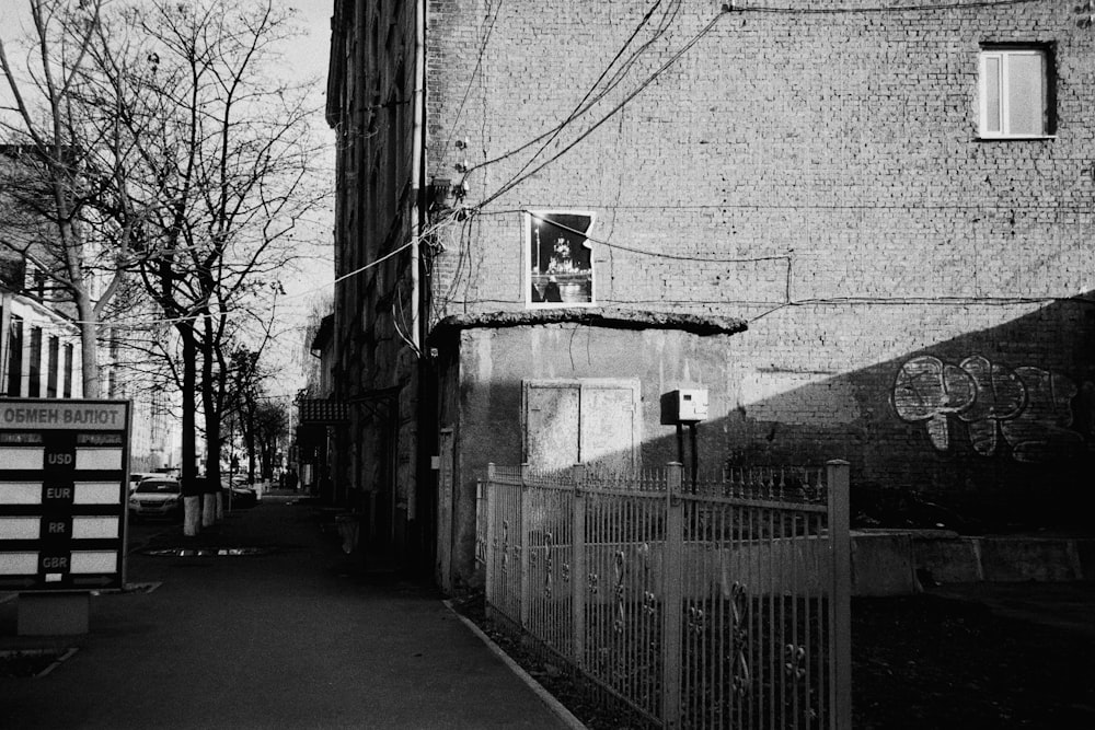 a black and white photo of an alley