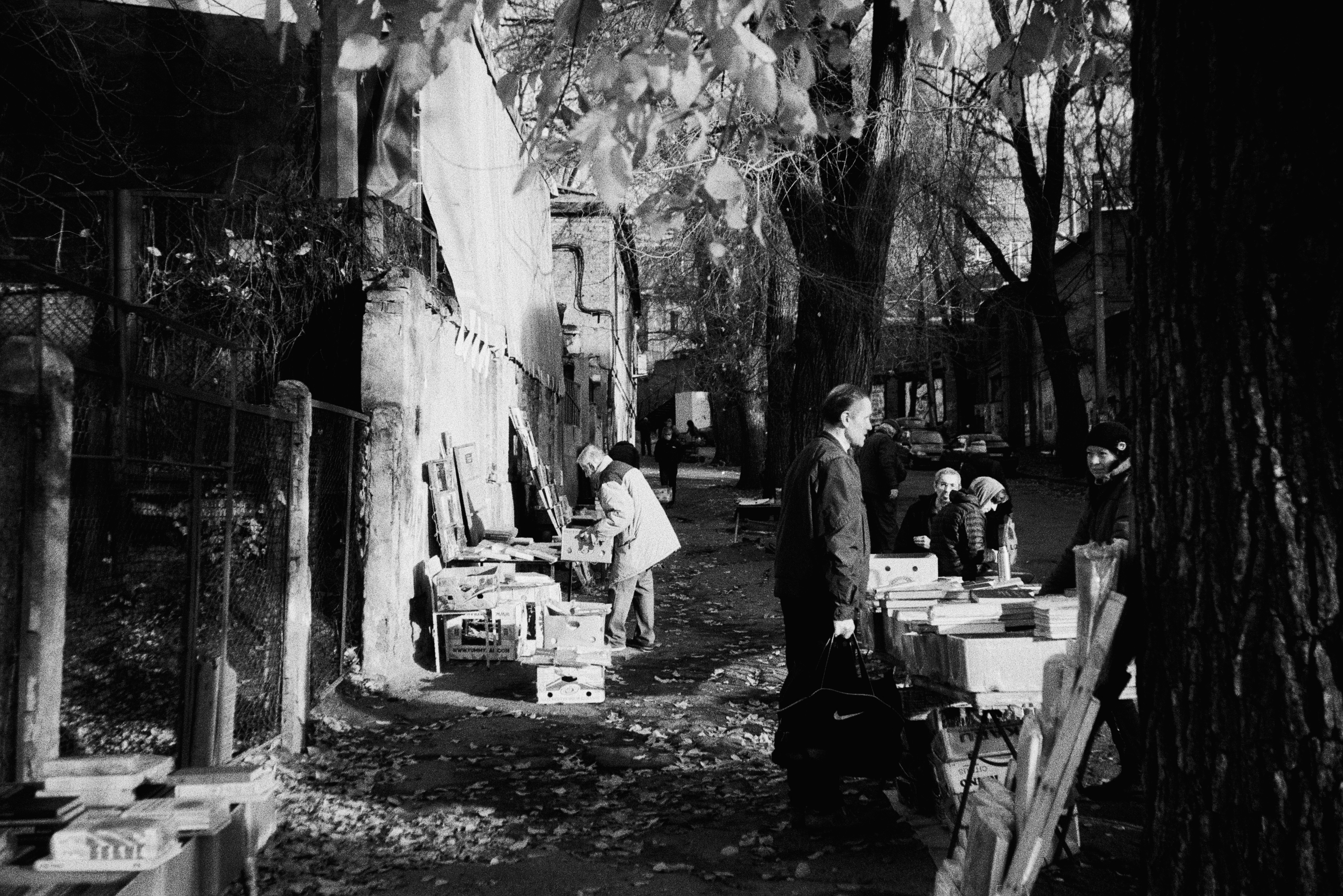 a group of people on a sidewalk