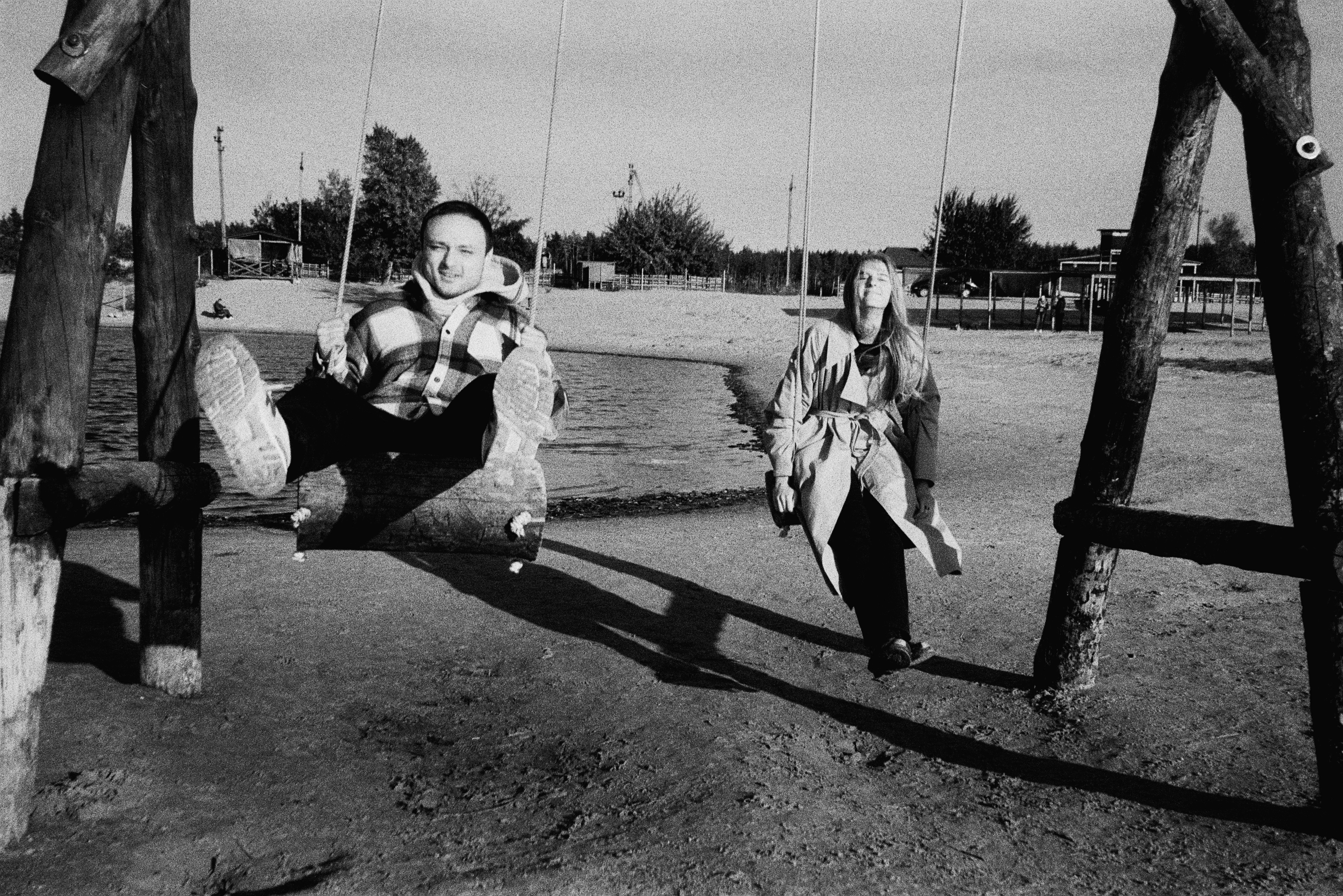 a man and a woman sitting on a bench