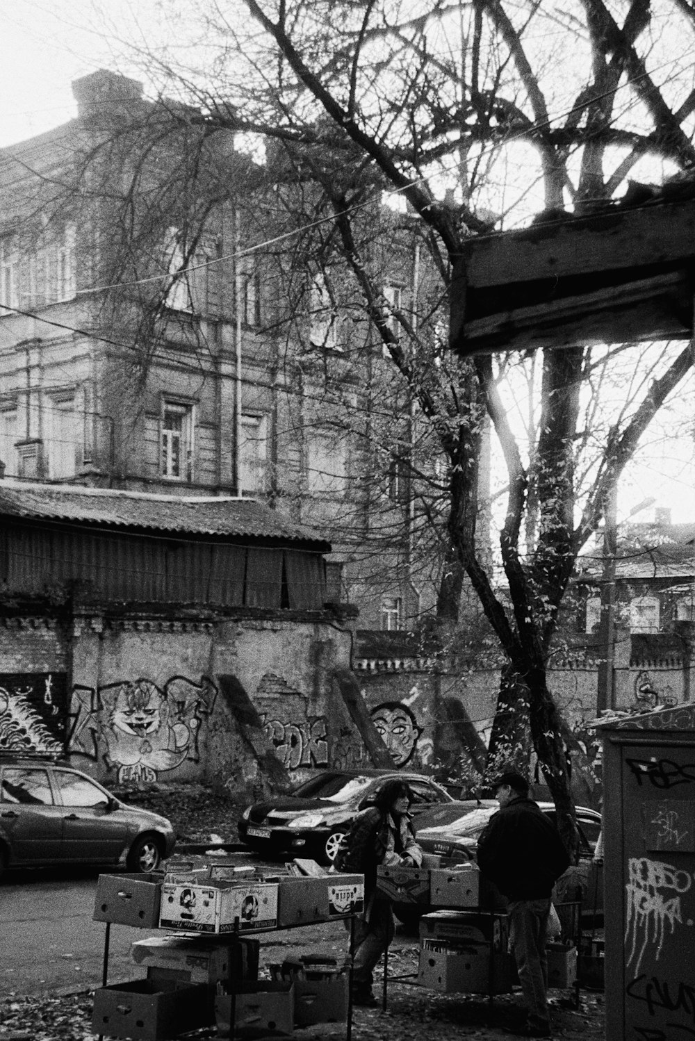 a black and white photo of a street corner