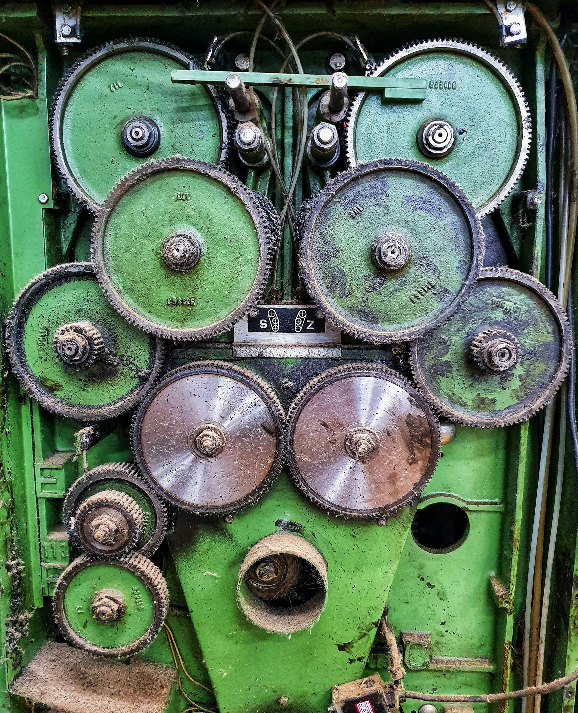a green machine with lots of gears on it