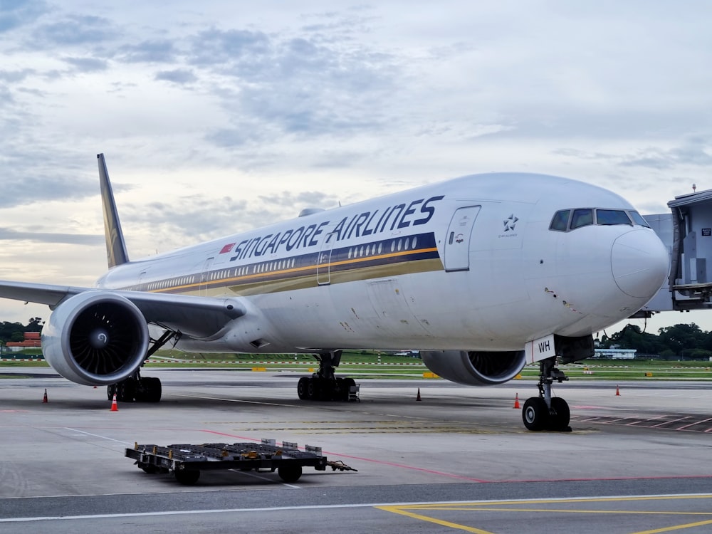 a large jetliner sitting on top of an airport tarmac