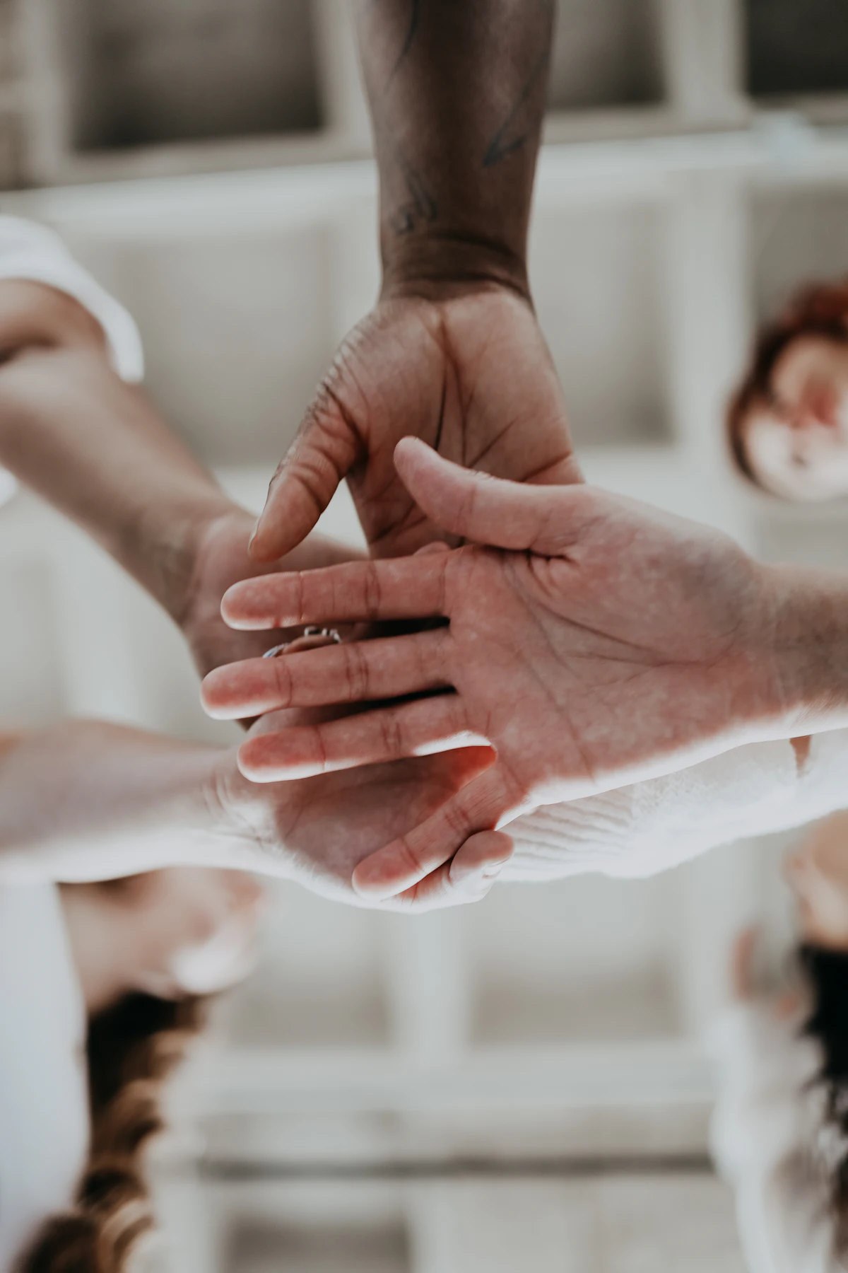 Colleagues bringing their hands together