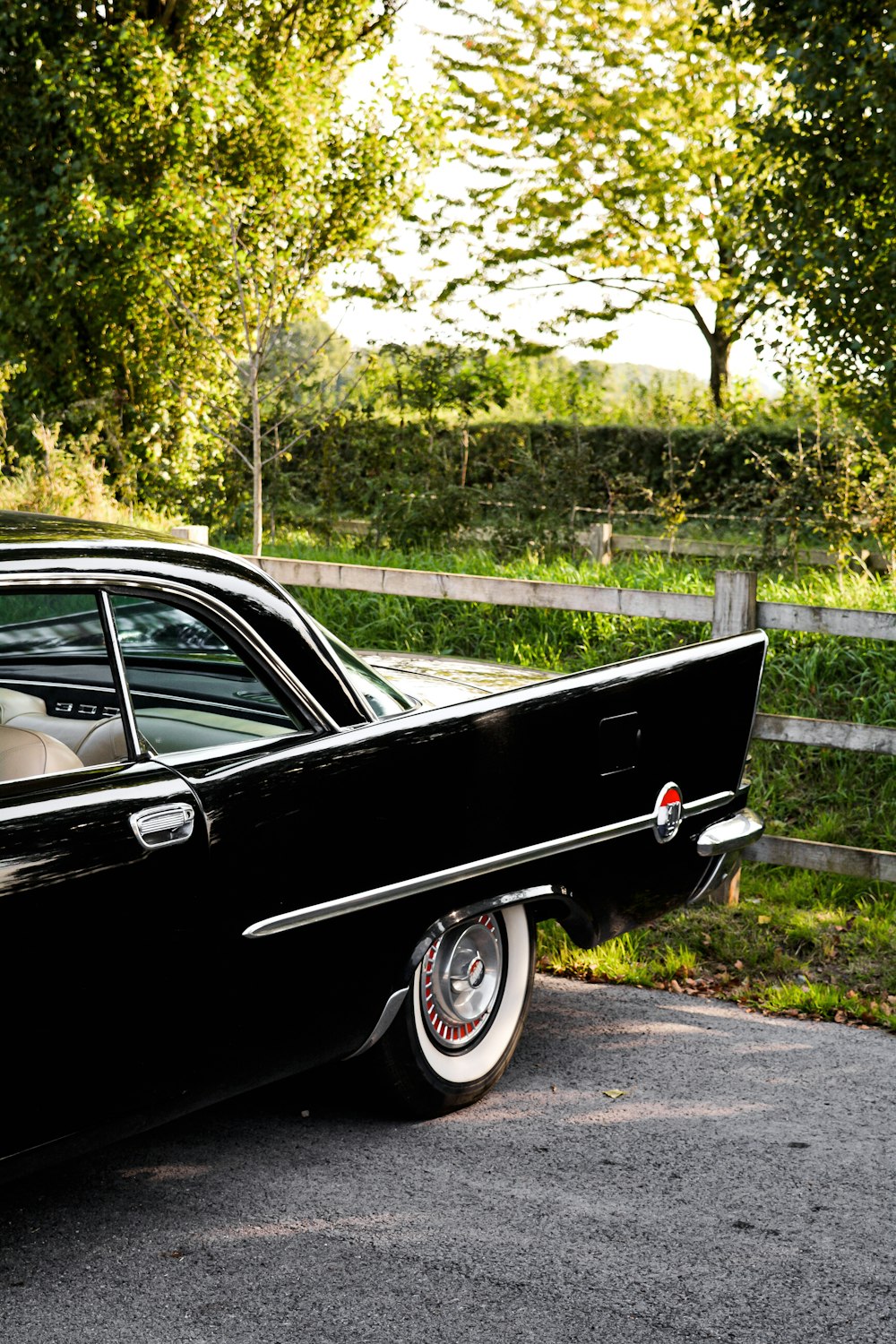 a black car parked on the side of the road