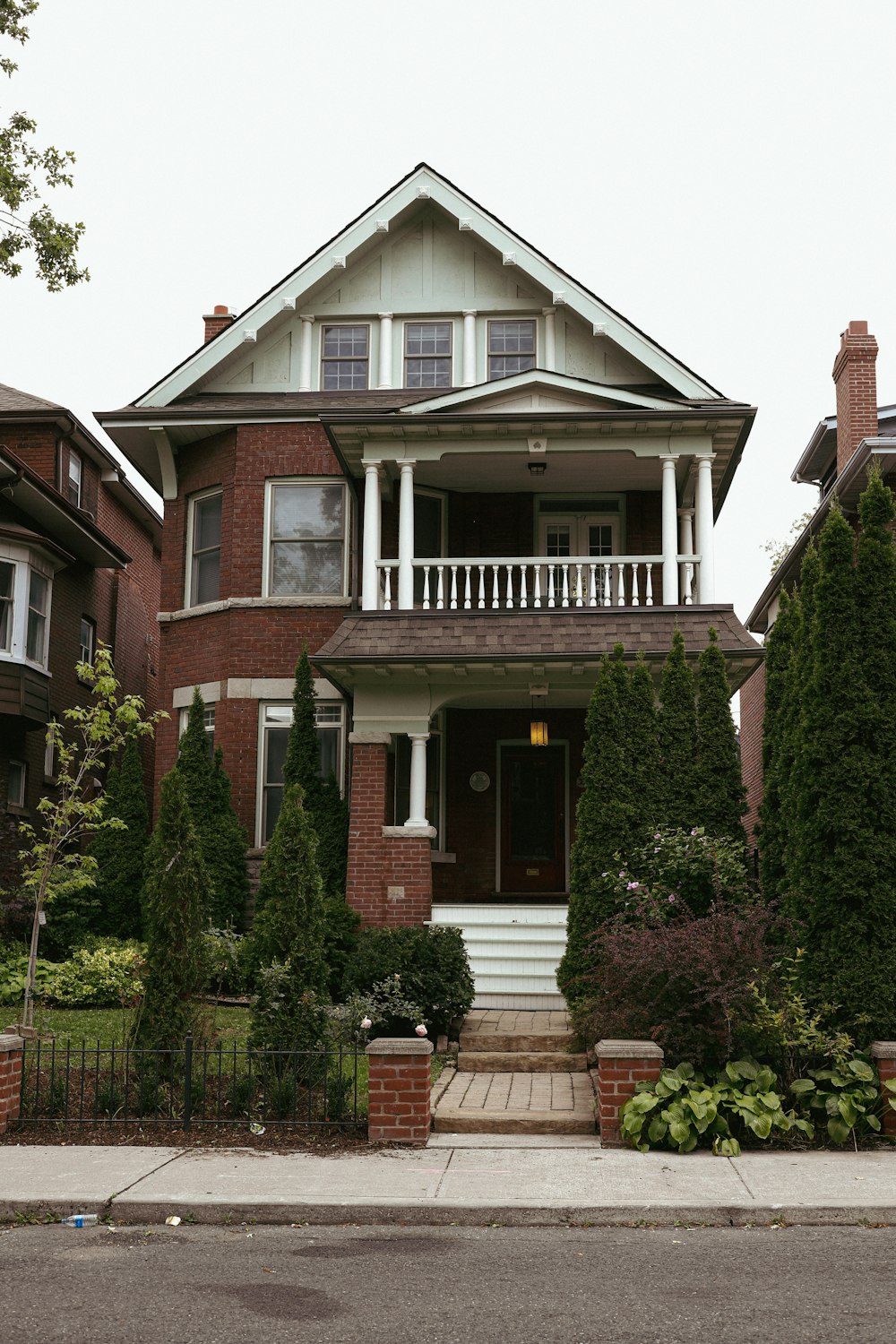 a large brick house with a large front porch