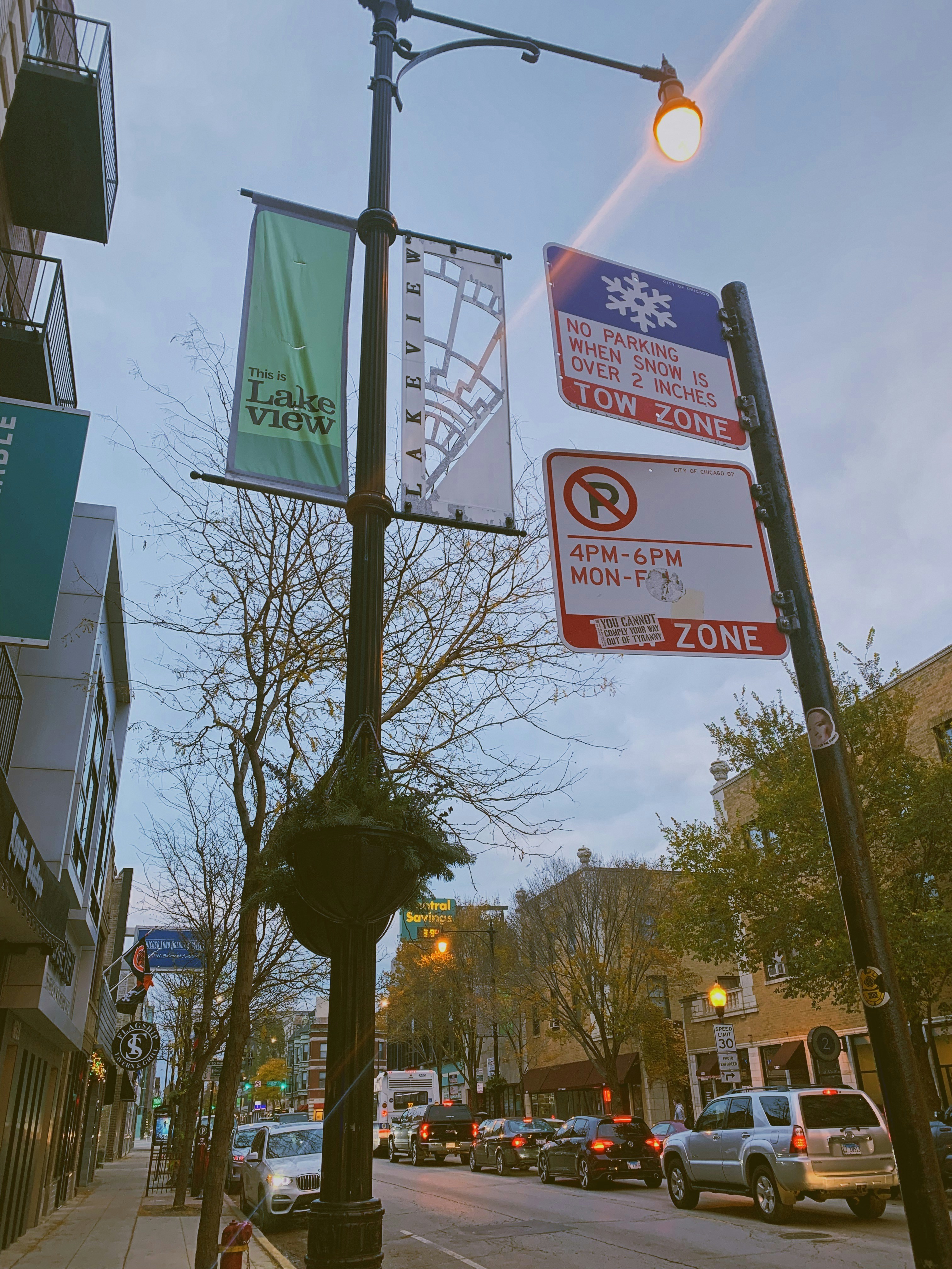 a street sign on a pole on a city street