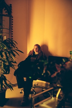 A calm therapy session with a client and therapist in a cozy, well-lit room