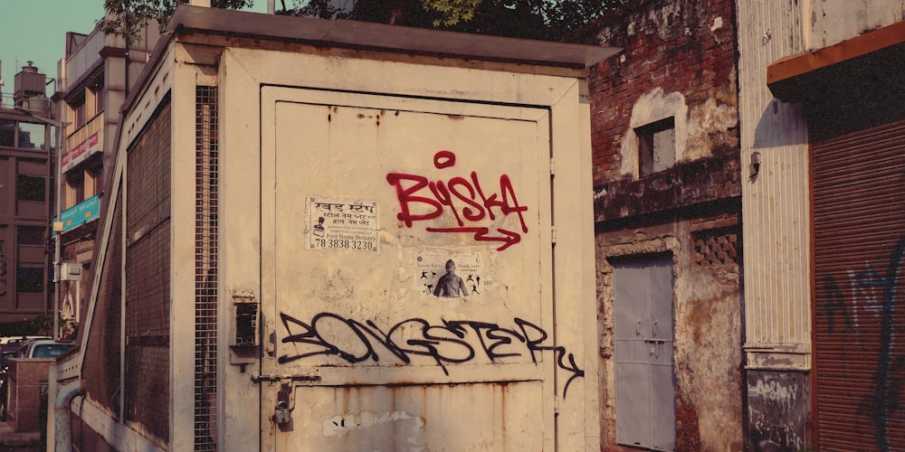 a run down building with graffiti on it