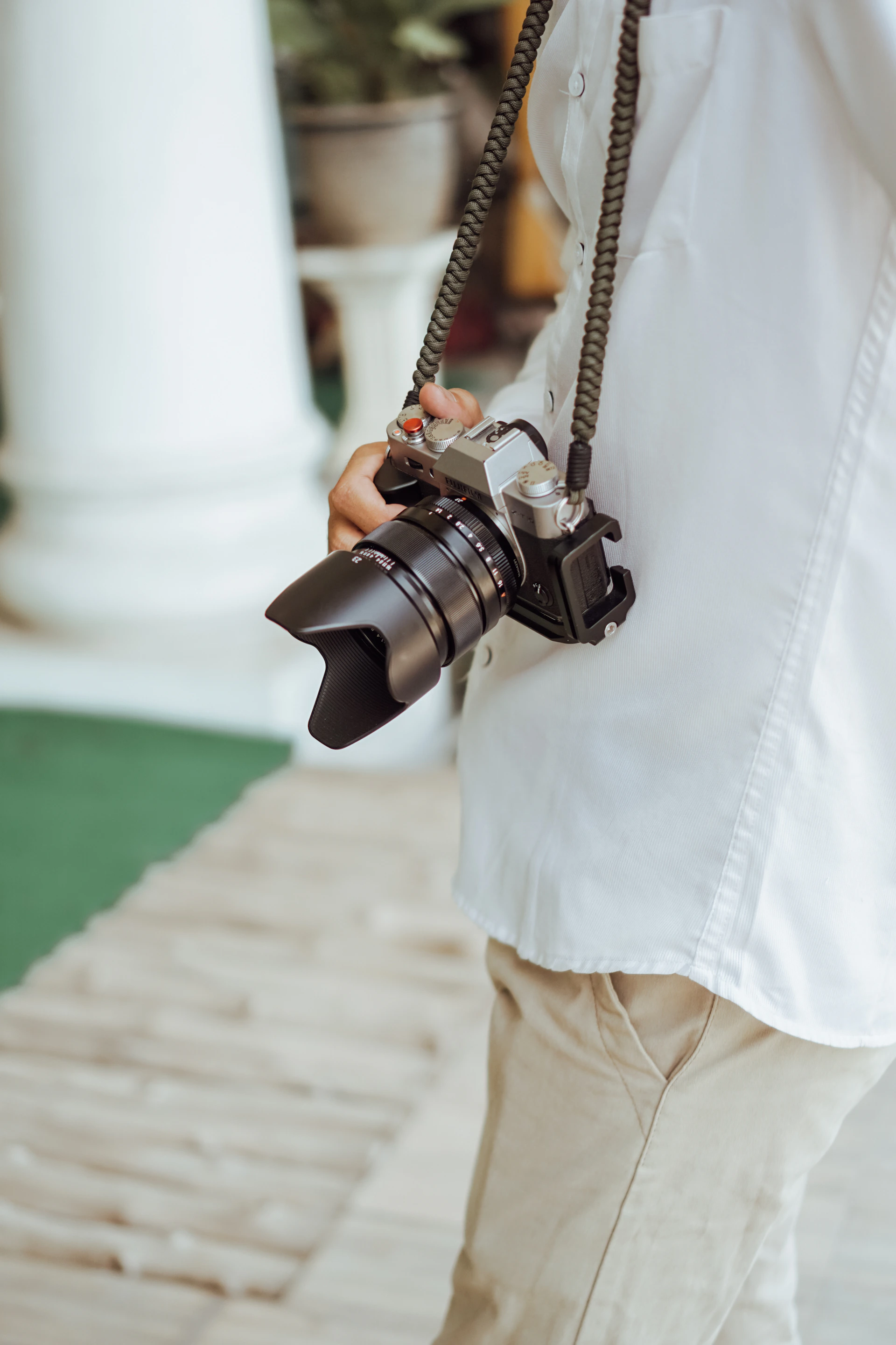 a person holding a camera in their hand
