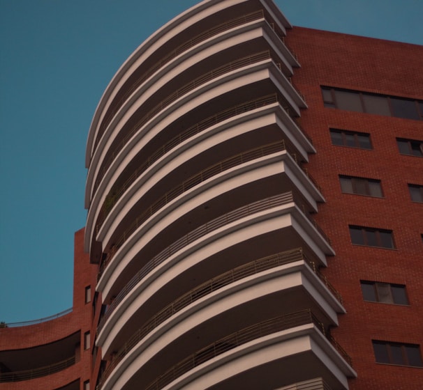 a tall building with a clock on the side of it