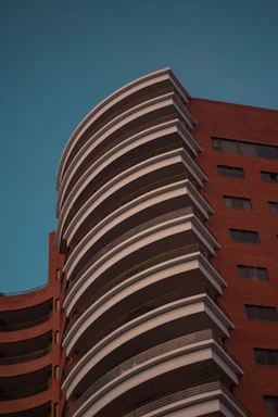 a tall building with a clock on the side of it