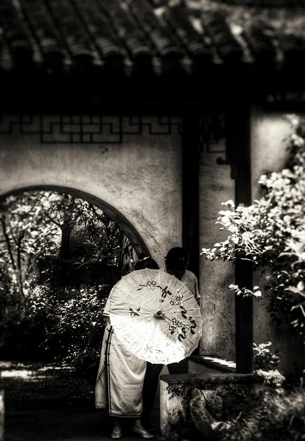 a woman in a kimono holding an umbrella