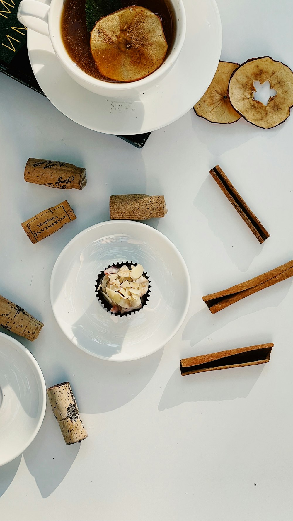 a cup of coffee and some wine corks