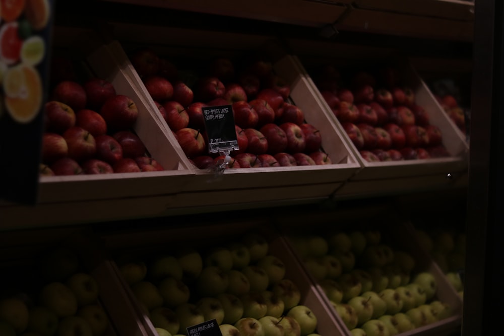 a display in a grocery store filled with lots of apples