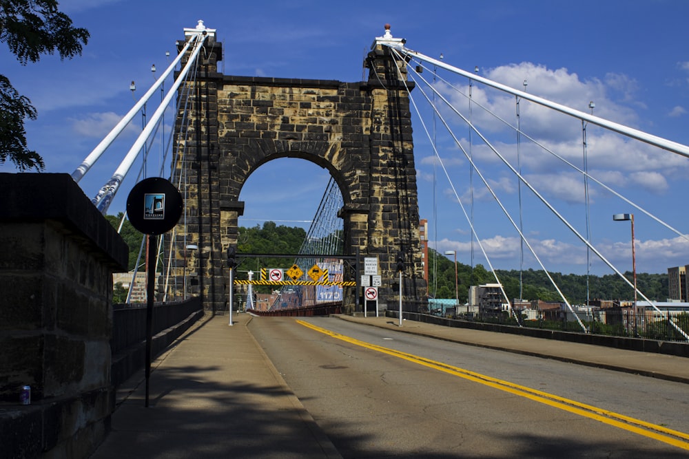 a view of a bridge from the side of the road