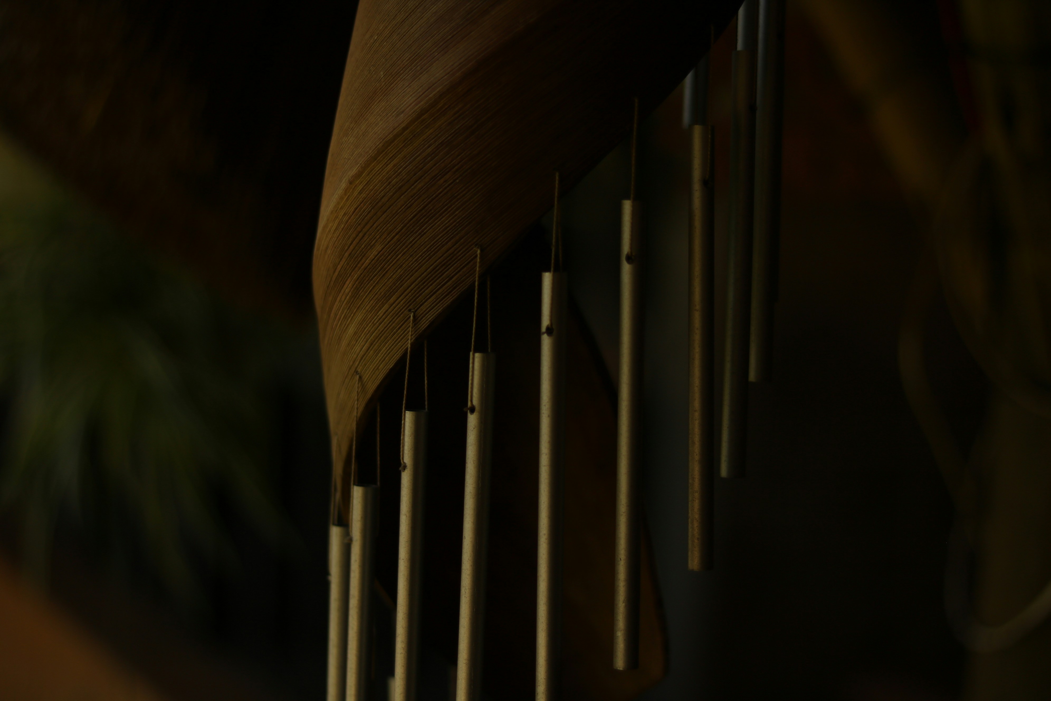 a close up of a wooden wind chime