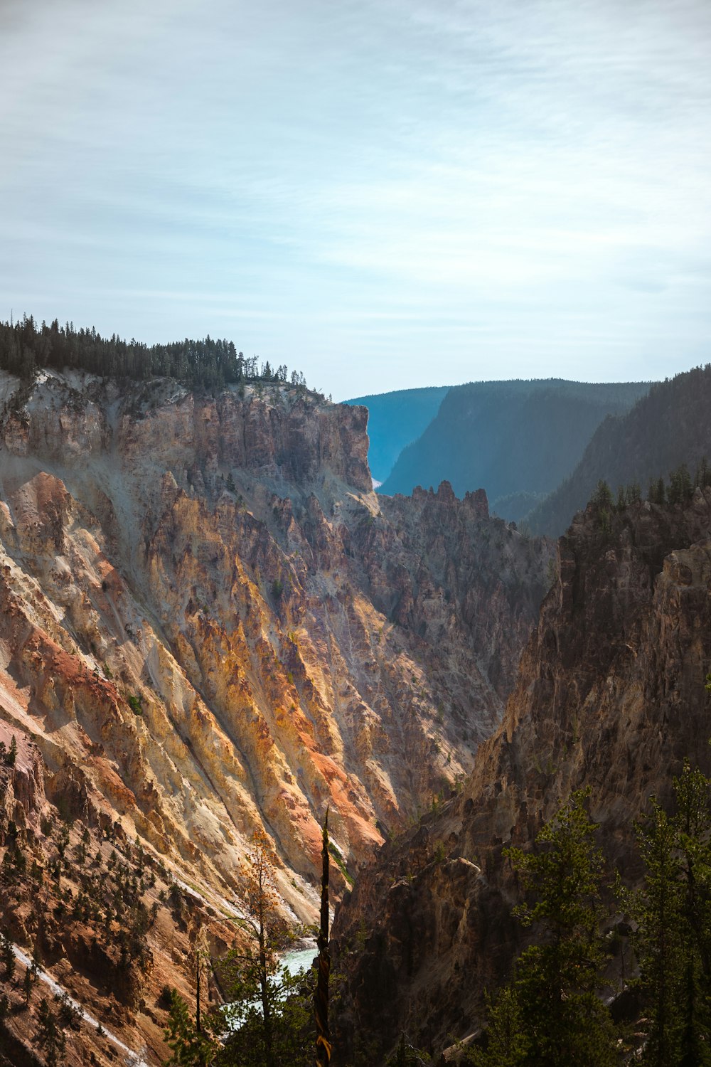 a scenic view of a mountain with a river running through it