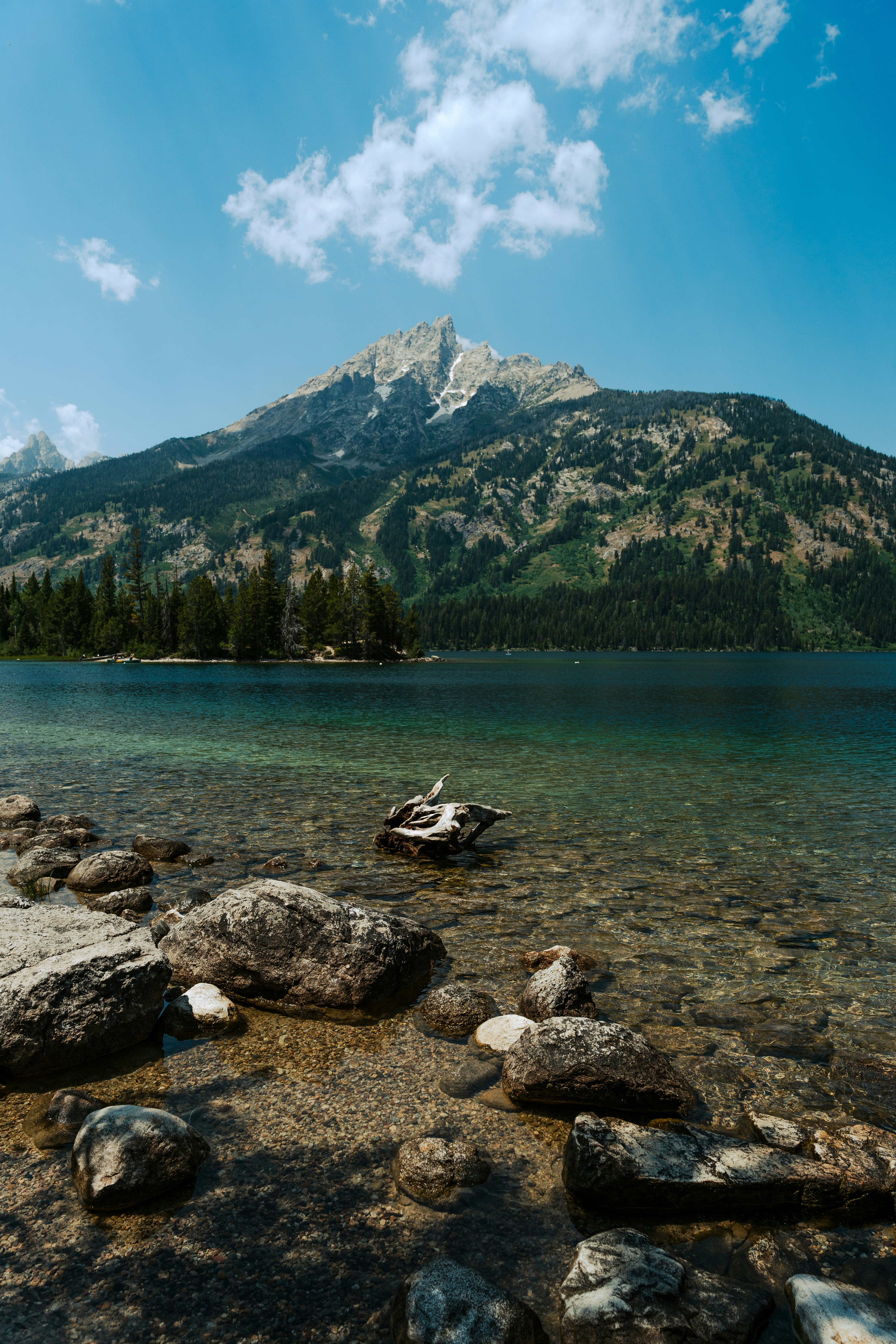 a lake with a mountain in the background