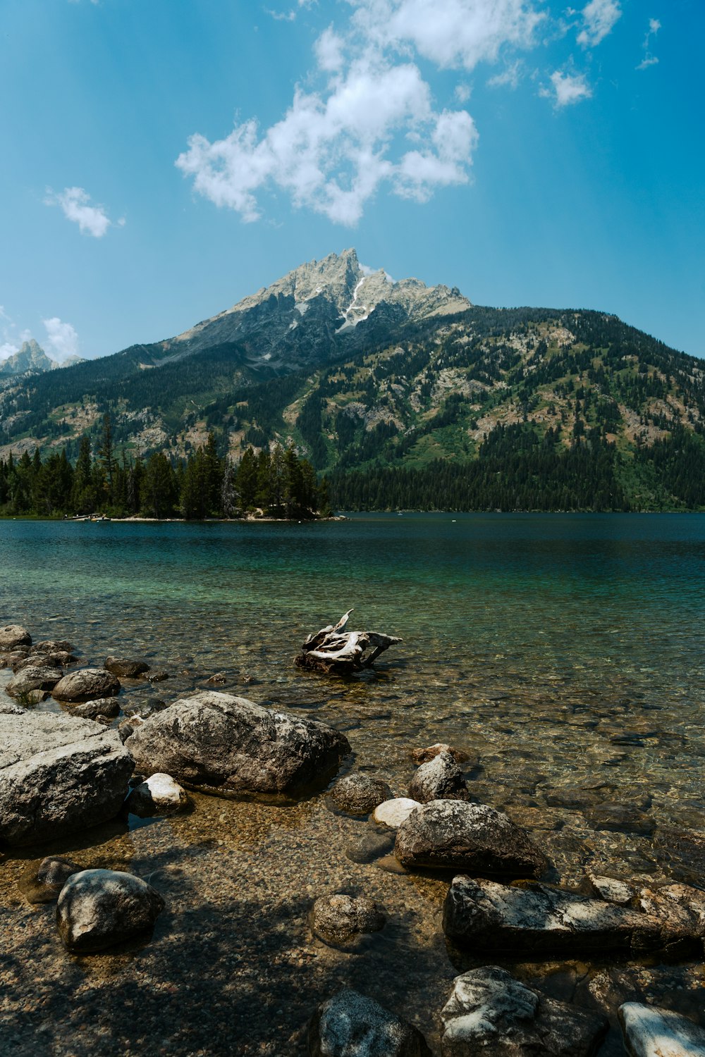 a lake with a mountain in the background