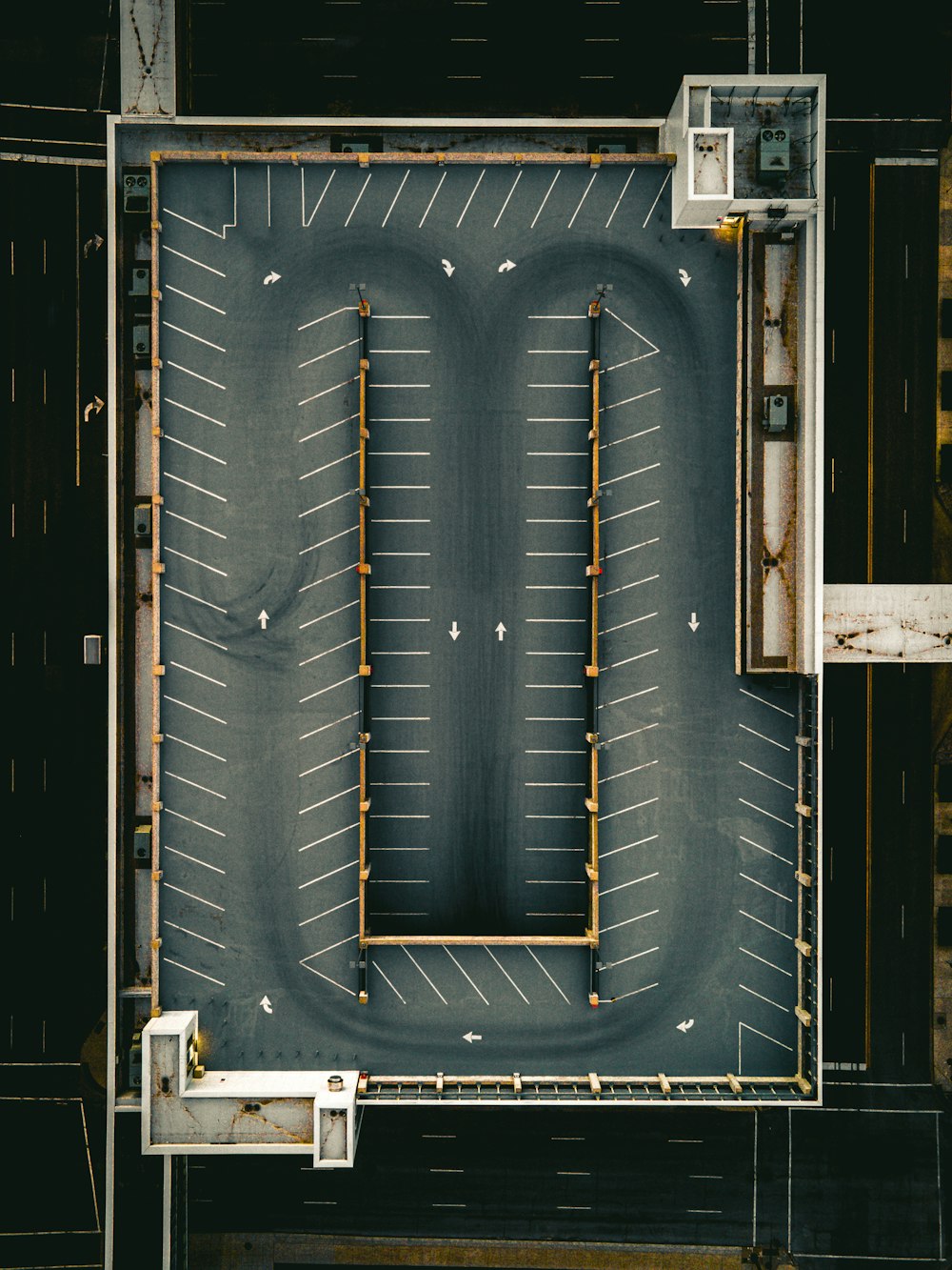 an overhead view of an empty parking lot